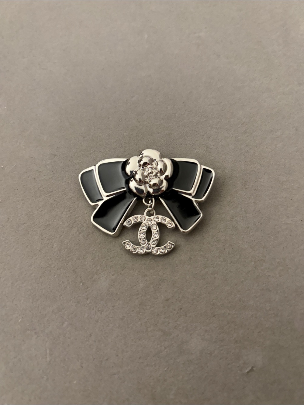 Black Enamel Bow Brooch with Camellia and Crystals